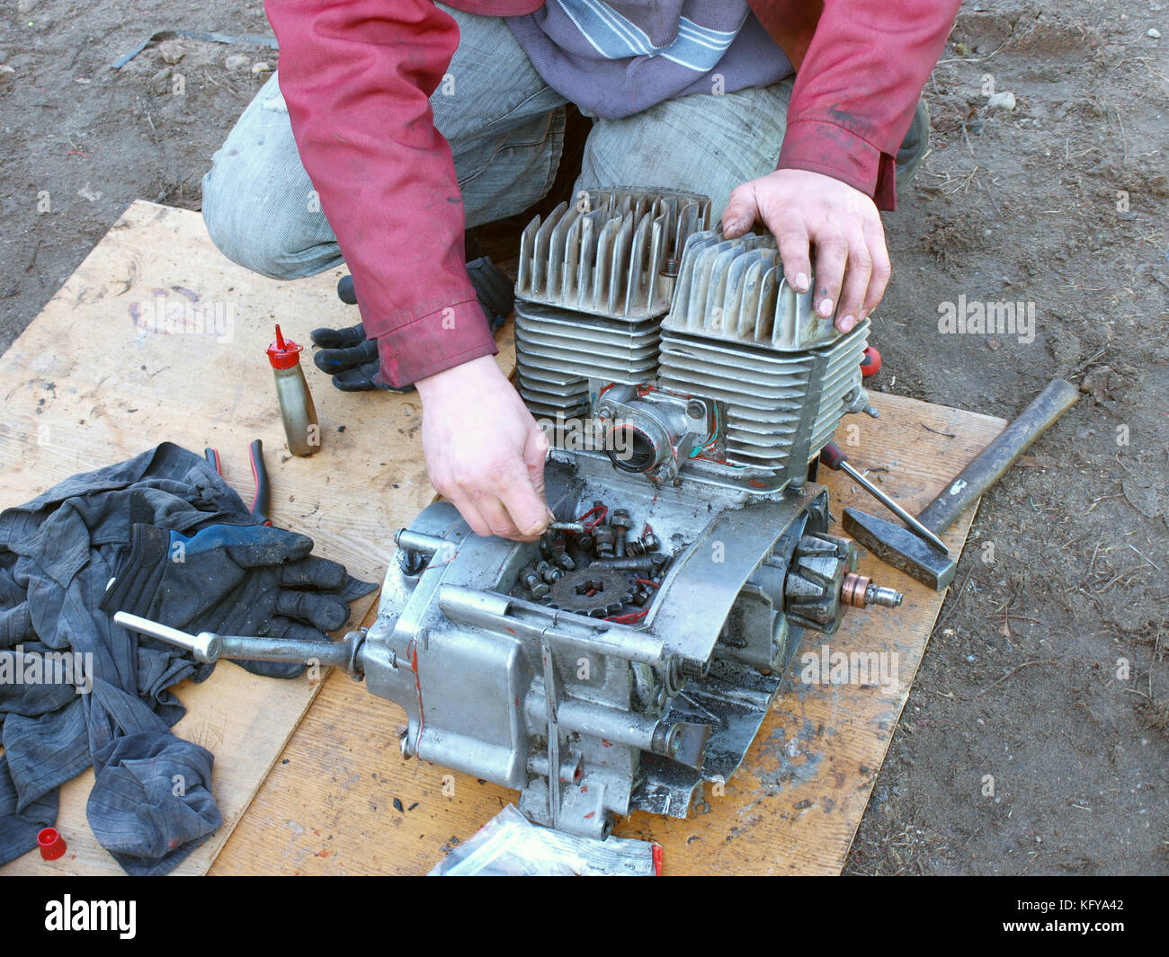 Repairing motorcycle engine outdoor view close up Stock Photo - Alamy