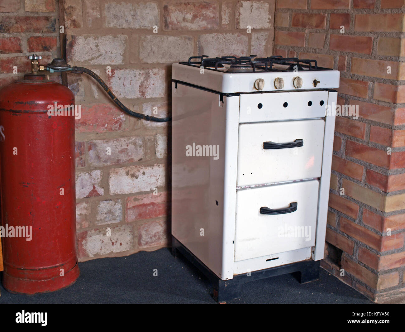 Old kitchen gas stove with gas cylinder Stock Photo Alamy