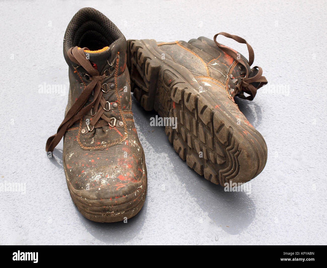 Dirty work boots with color splashes close up Stock Photo Alamy