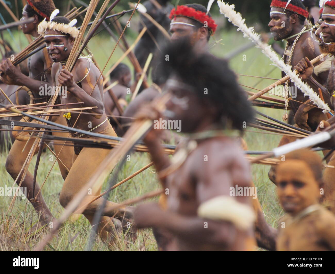 Tribesmen participating in a show war during Baliem Valley Festival in Papua Stock Photo