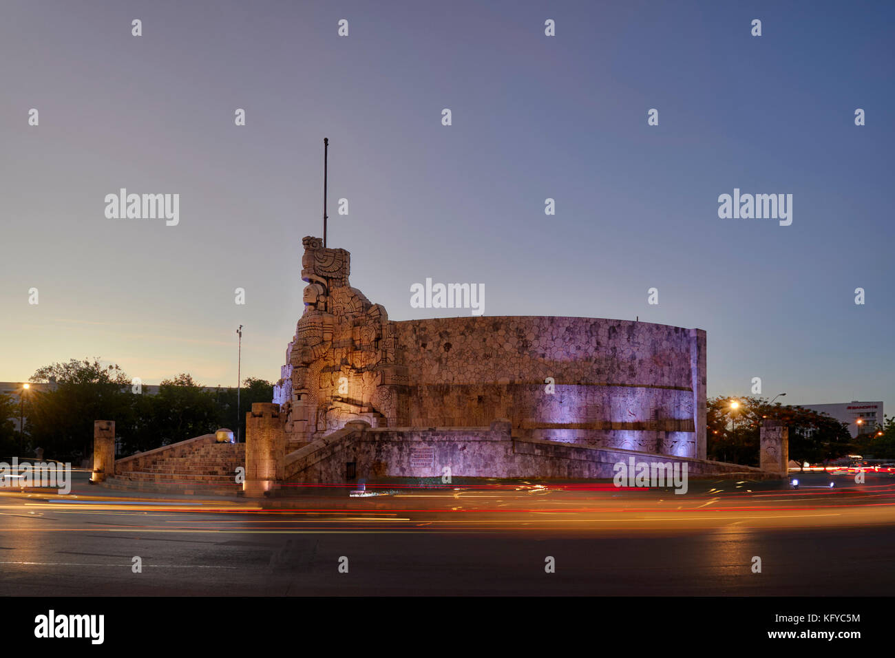 Night shot of the Monument to Motherland, Monumento a La Patria in spanish, with car light trails, in Merida, Yucatan, Mexico Stock Photo