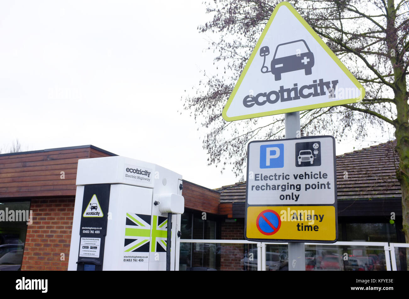An electric vehicle charging point and parking space at a motorway service station in the UK. Stock Photo