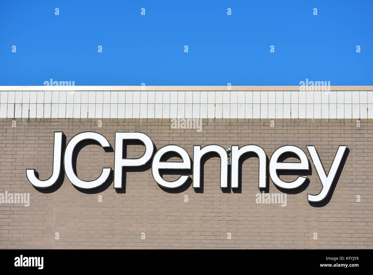 An old JC Penny store located at Bellis Fair mall in Bellingham, Washington.  The brickwork and signage are old and in need of repairs. Stock Photo