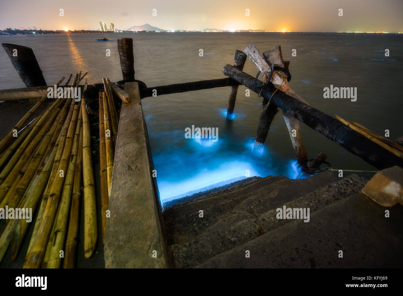 Bioluminescence phenomena at a sea shore showing beautiful indigo and blue color glowing. Stock Photo