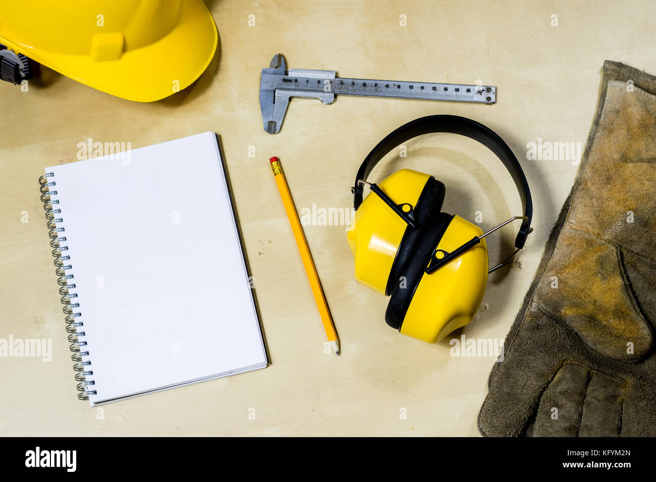 helmet, hearing protection, tools, table. Safety equipment and tools Stock Photo Alamy