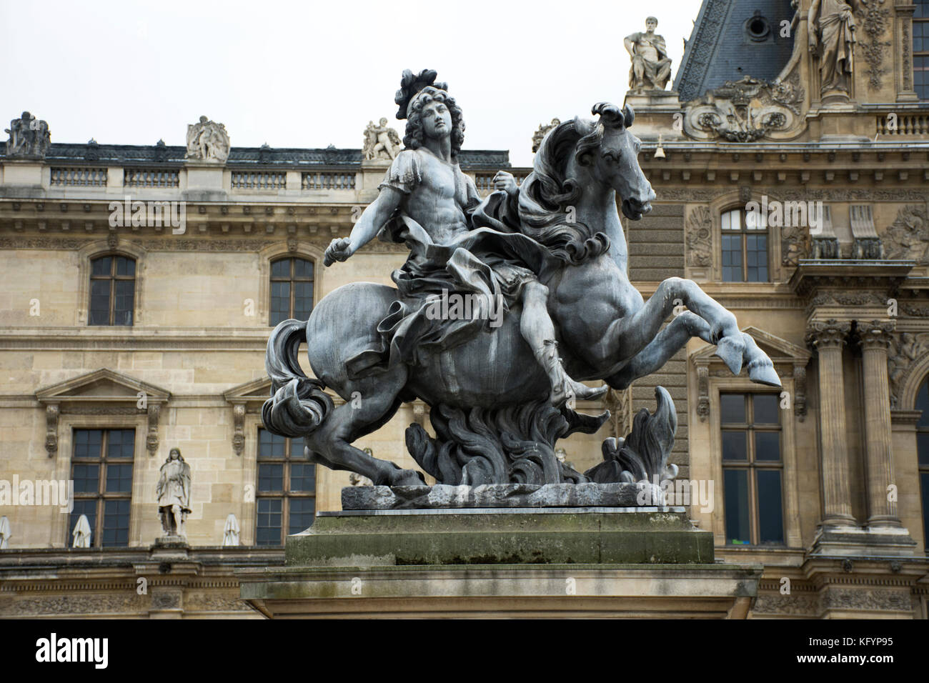 King Louis XIV Statue at Cour Napoleon the entrance to the Musee du