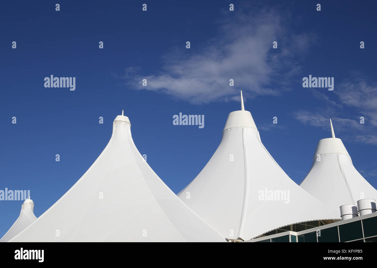 The Teflon-coated fiberglass roof of Denver International Airport resembles the Rocky Mountains. Stock Photo