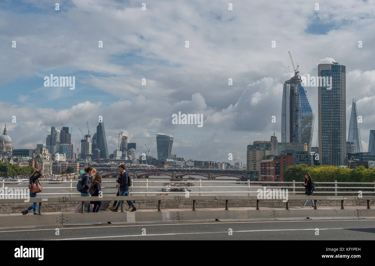 View of London skyscrapers in the City of London and South Bank with pedestrians on Waterloo Bridge, September 2017 Stock Photo