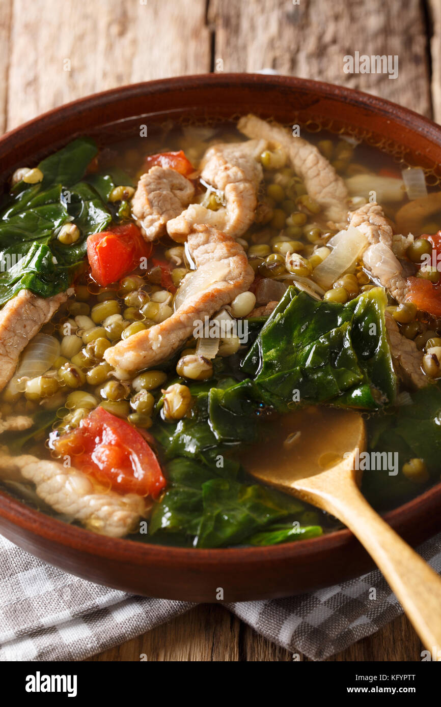 Munggo Guisado Filipino soup of beans mung closeup in a bowl on the table. Vertical Stock Photo