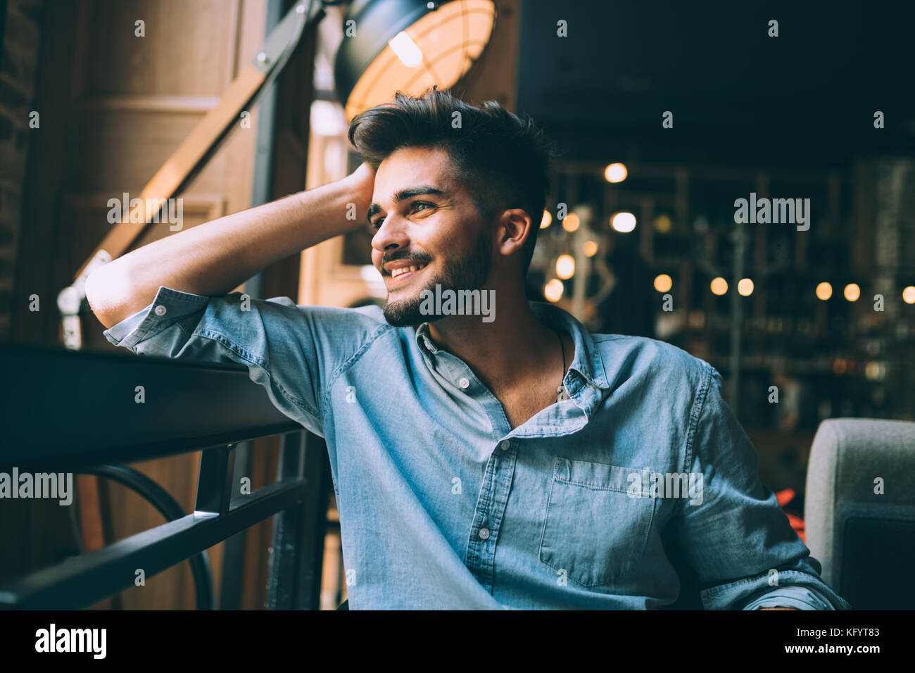 Portrait of young handsome man in blue shirt Stock Photo