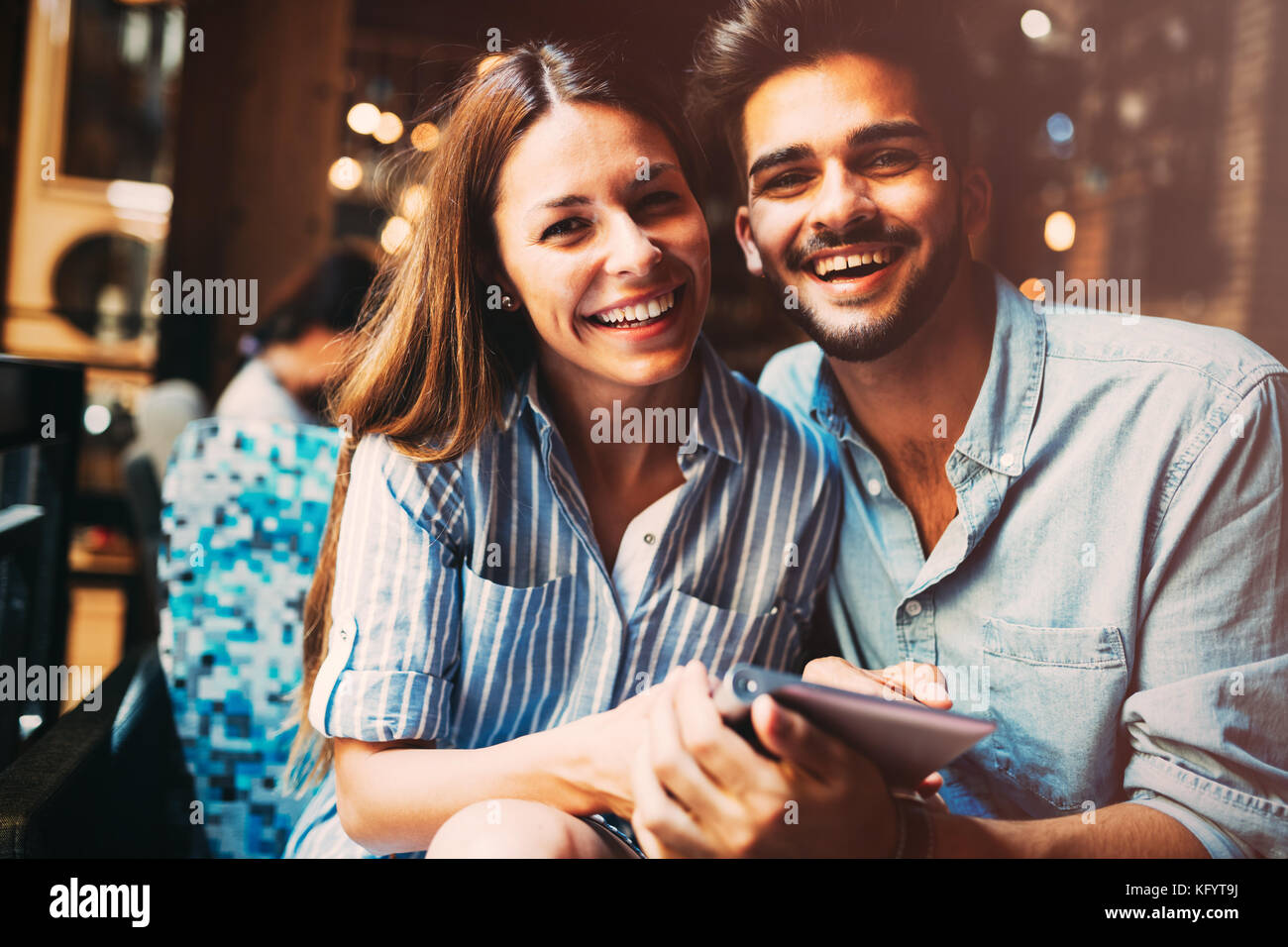 Young attractive couple on date in coffee shop Stock Photo