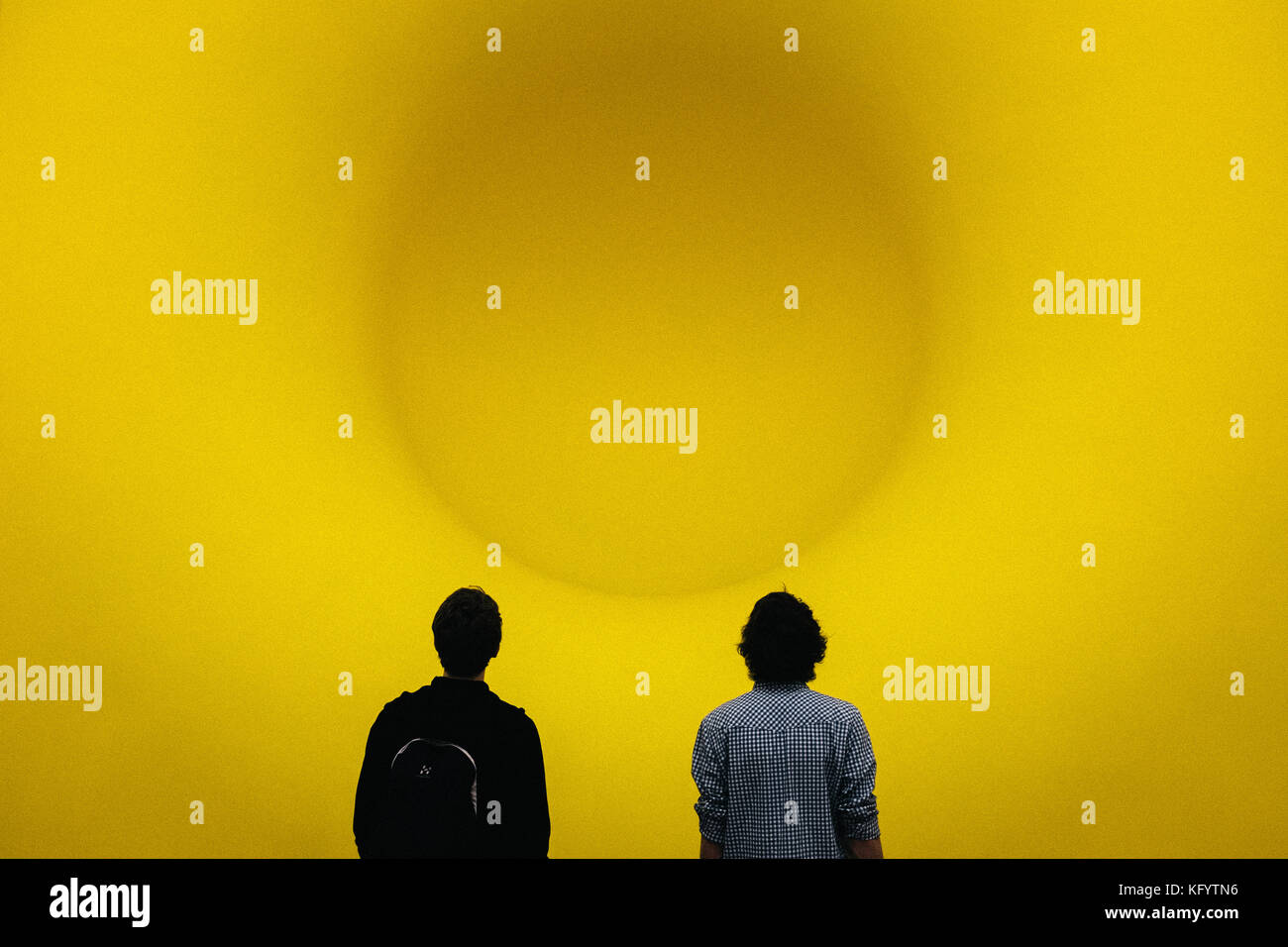 Istanbul, Turkey - January 21, 2014. Two visitors are looking at Anish Kapoor's work Yellow at the Sakip Sabanci Museum in Istanbul. Stock Photo