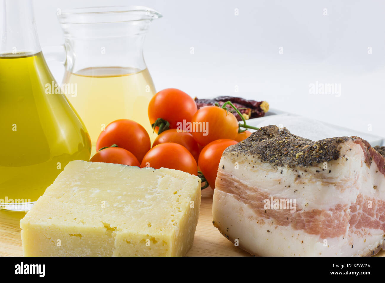 The ingredients for the pasta Amatriciana including bacon, cheese
