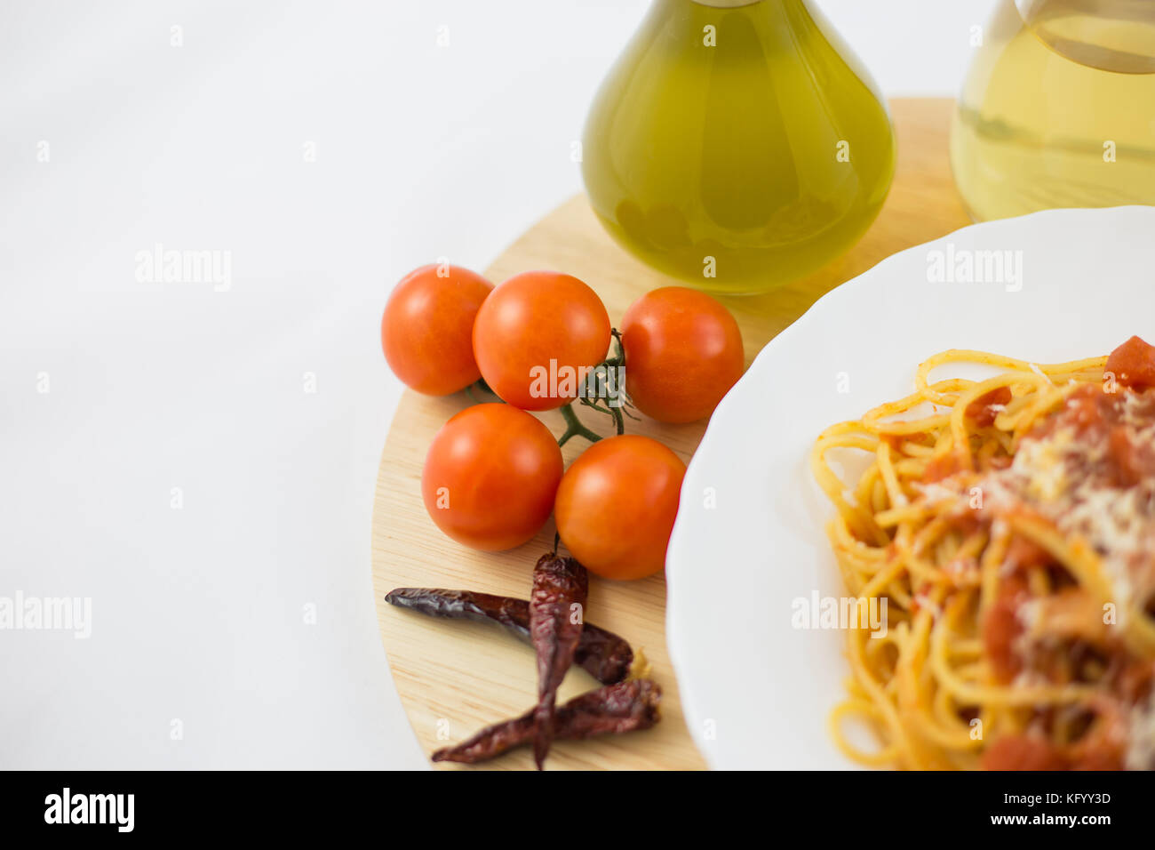 Amatriciana pasta and ingredients, such as bacon, cheese, tomato