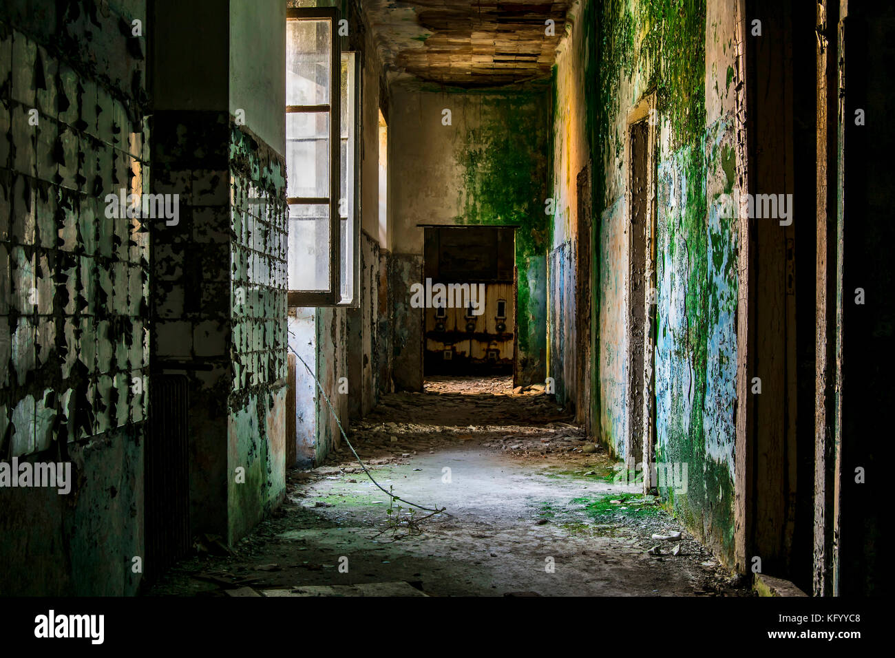 a view on a creepy corridon inside a psychiatric hospital abandoned some years ago Stock Photo