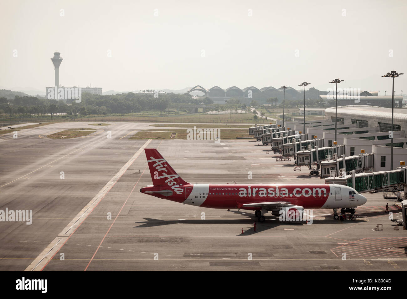 An AirAsia Bhd. A320 aircraft stands on the tarmac at Kuala Lumpur International Airport 2 (KLIA2) in Sepang, Selangor, Malaysia Stock Photo