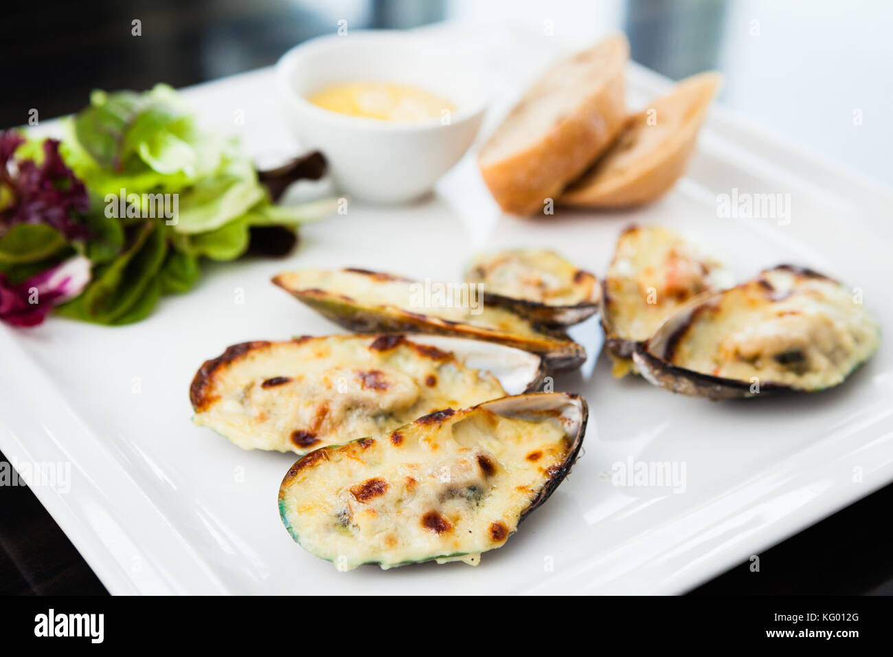 Baked mussels au gratin Stock Photo Alamy
