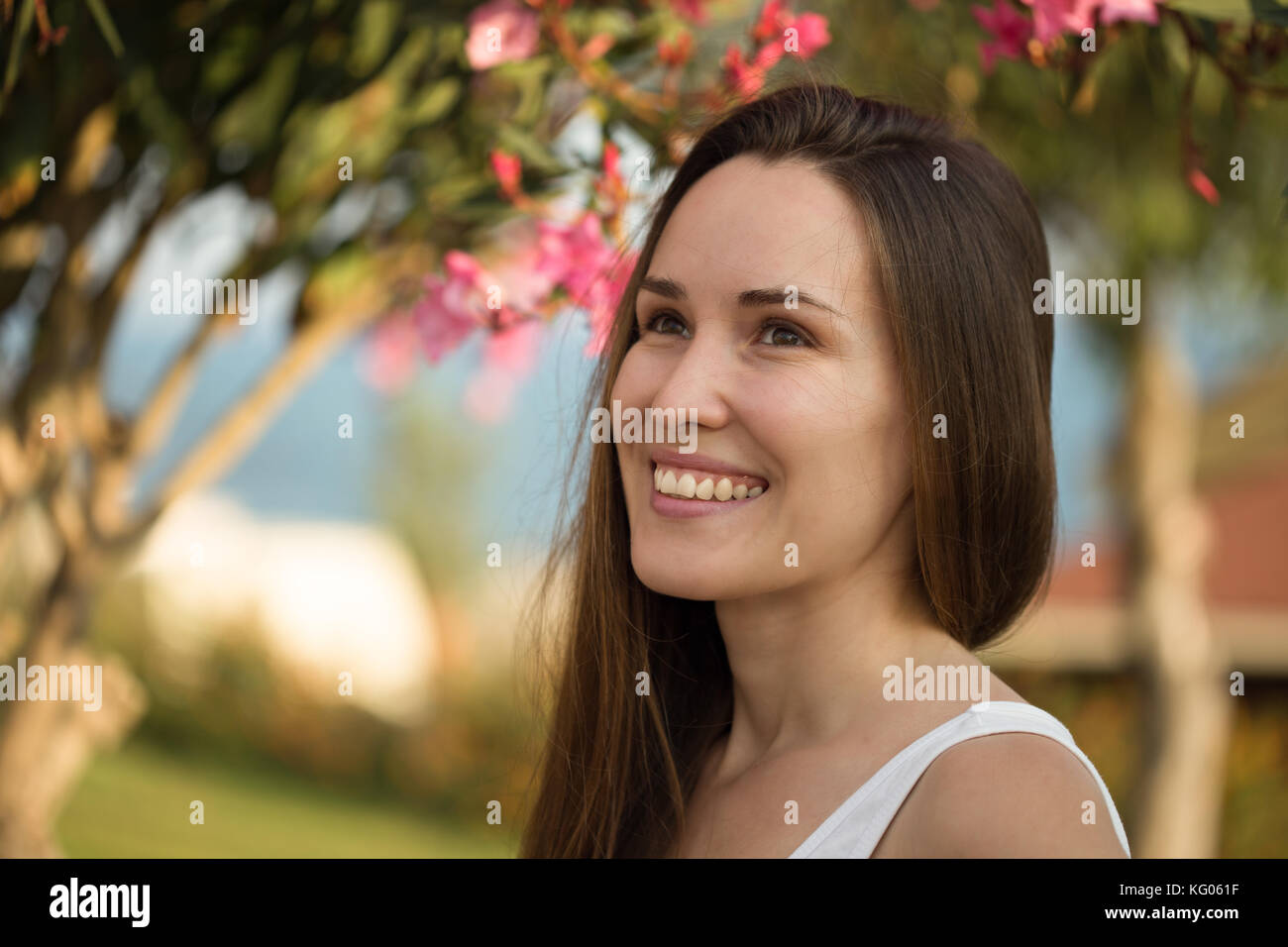 Head and shoulders portrait of a beautiful young woman with straight ...