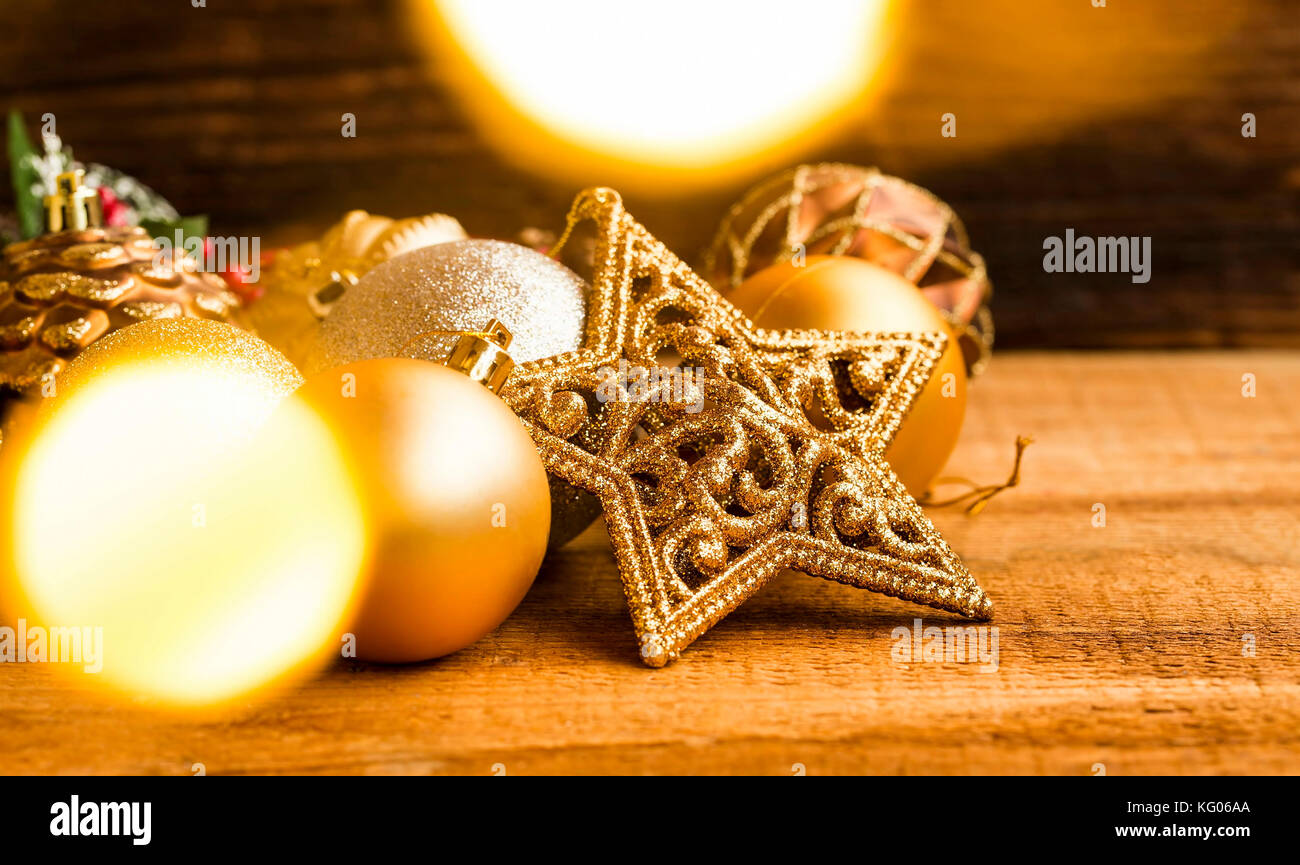 Festive Christmas golden star and balls decorations with bokeh golden ...