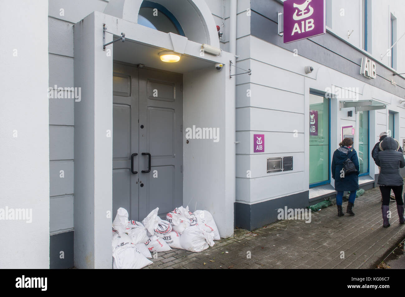 Sandbags in position against the main doors of AIB bank, Bantry, Ireland in case of flooding. Stock Photo