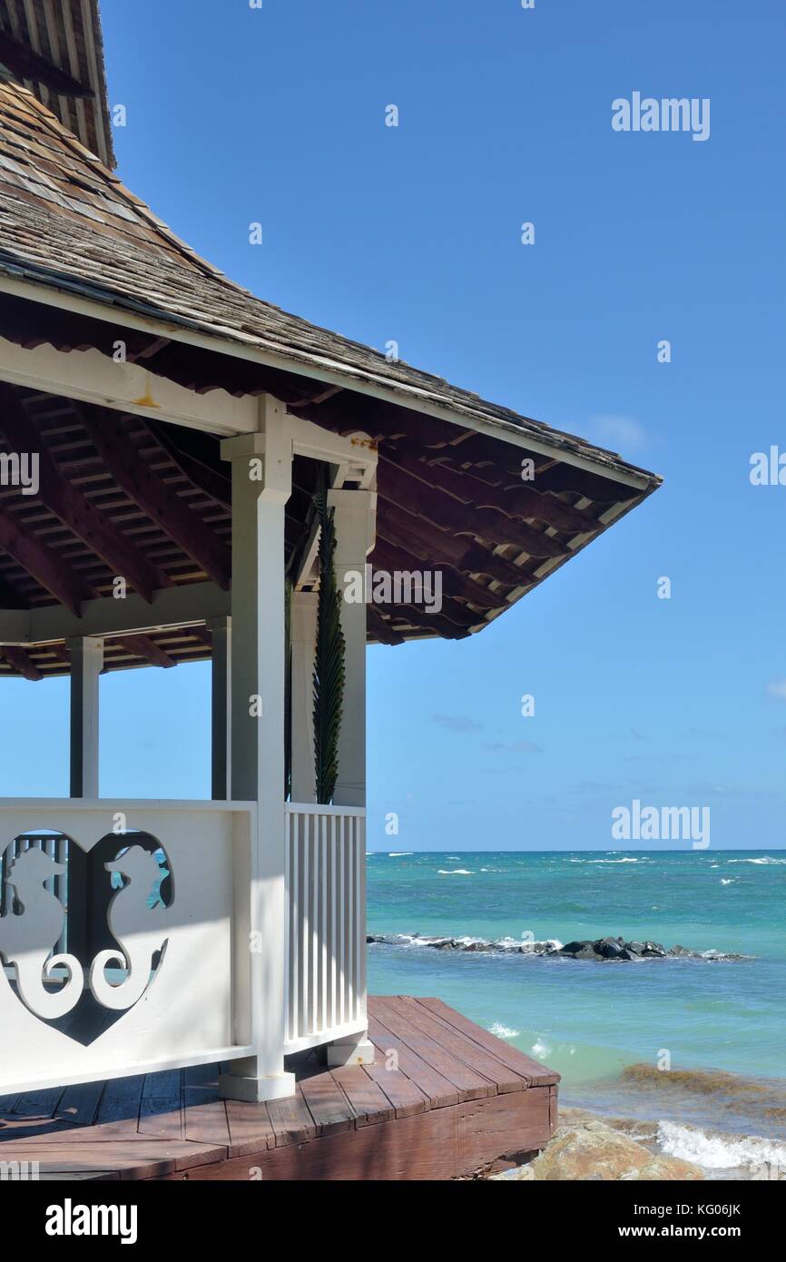 Ornate hut by sea Stock Photo