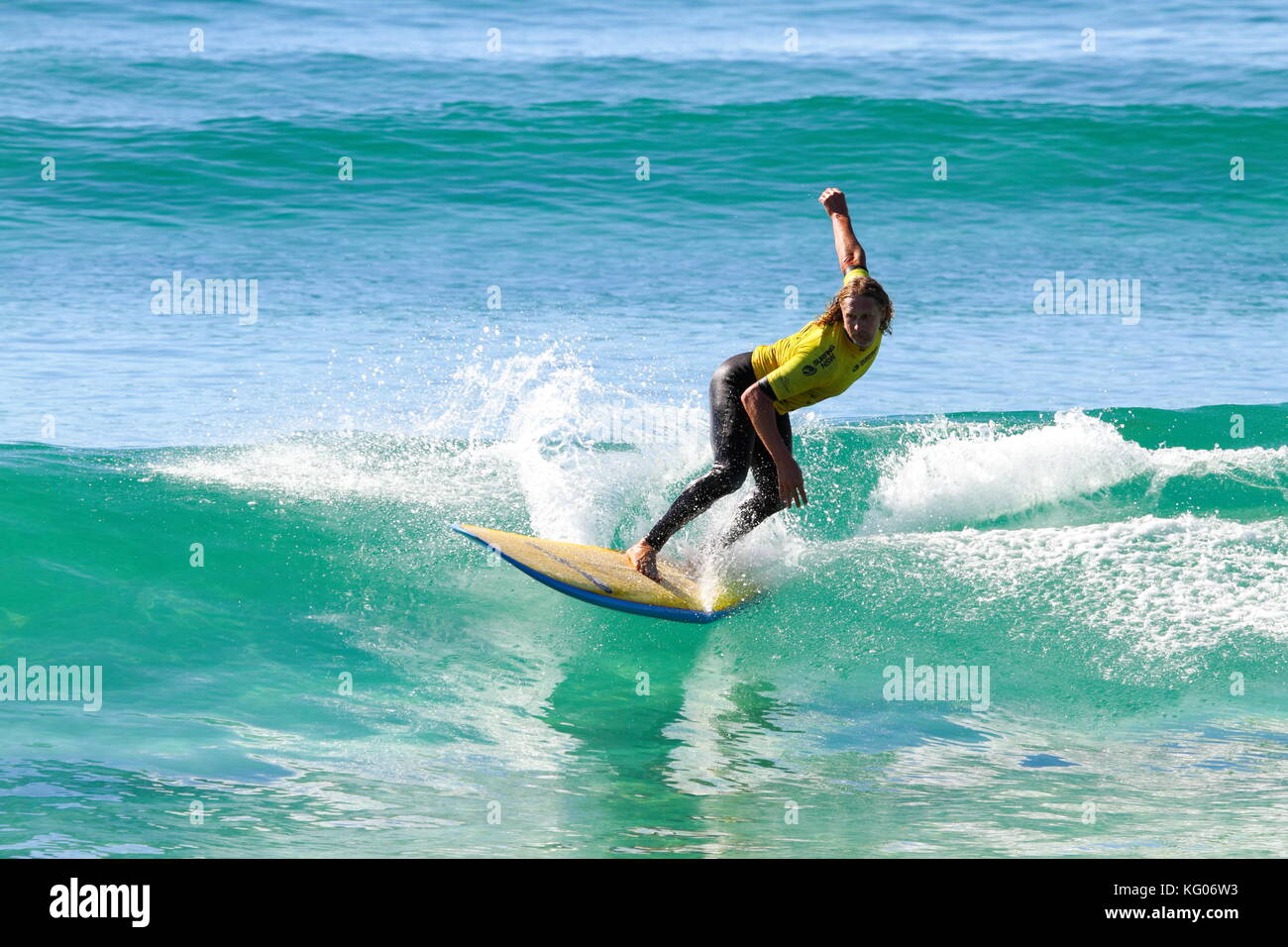 A man surfing a longboard surfboard. Stock Photo