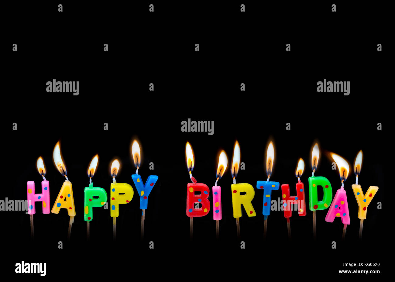 Colorful happy birthday candles on black background Stock Photo - Alamy