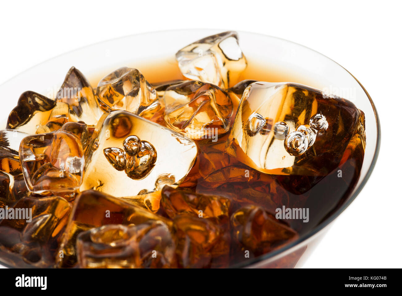 glass full of fresh cola with ice cubes, on white background Stock Photo
