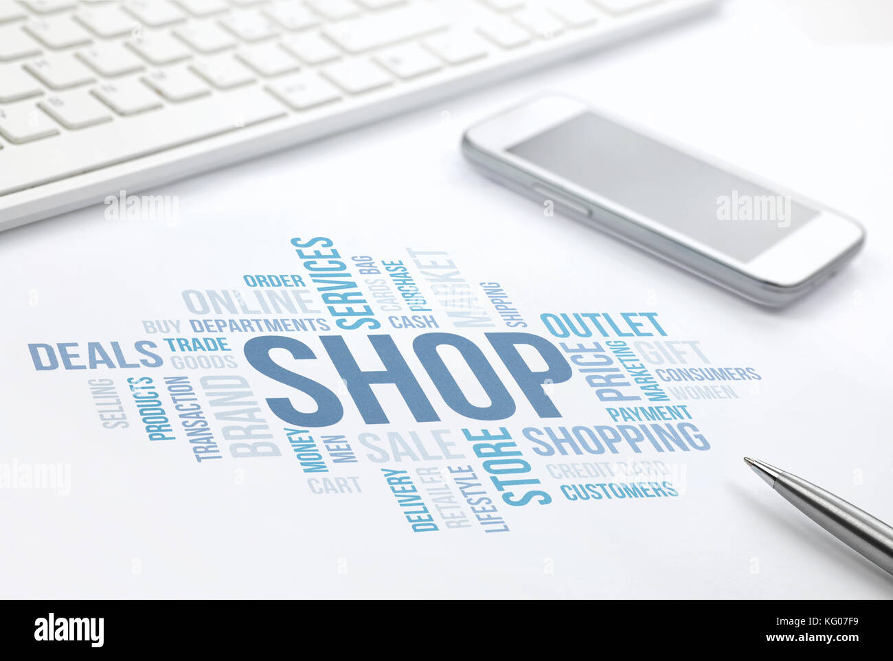 Shop concept word cloud print document, keyboard, pen and smartphone. Stock Photo