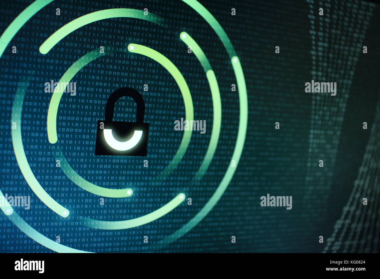 photo of computer screen display with black graphic lock symbol. Binary ...