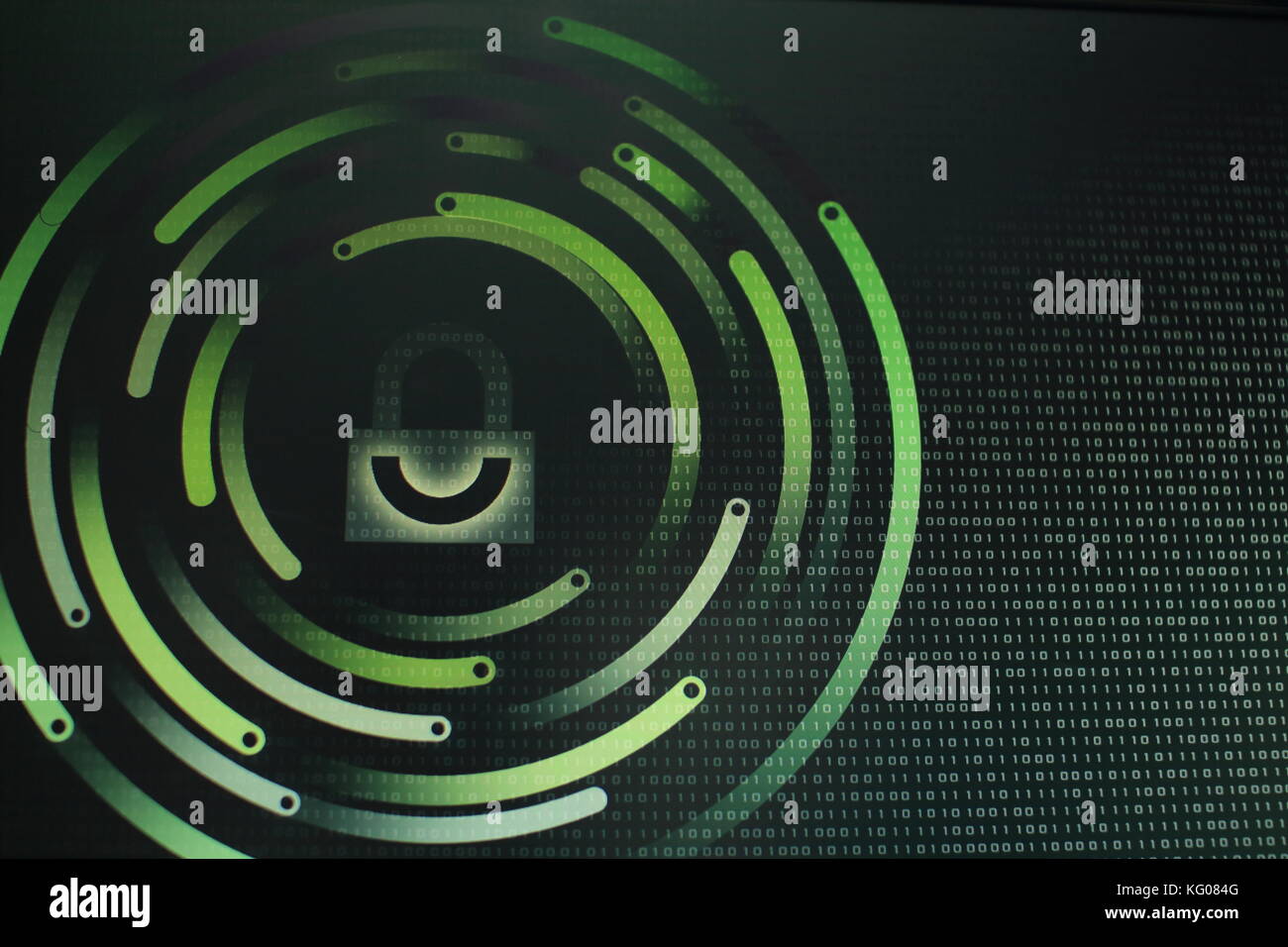 photo of computer screen display with black graphic lock symbol. Binary ...