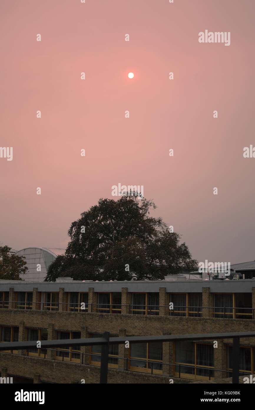 As Storm Ophelia passes over the UK, carrying dust drawn up from the Sahara, skies turn red over Cambridge University. Stock Photo