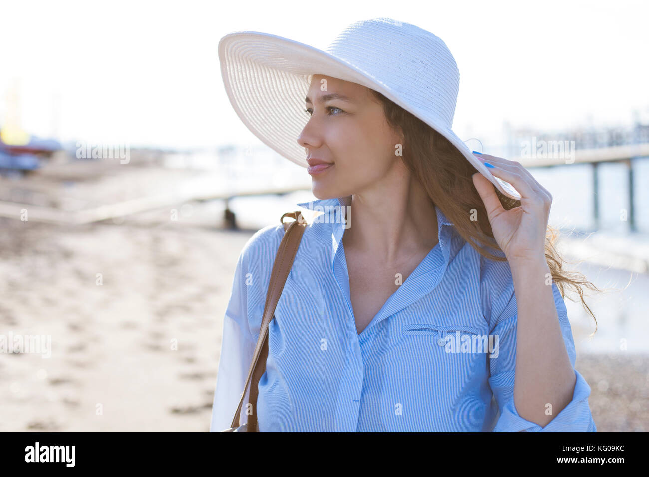 Young smiling woman at the beach near sea Stock Photo - Alamy