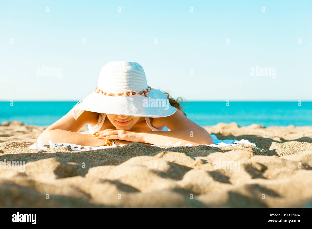 Woman lying in the sun hires stock photography and images Alamy