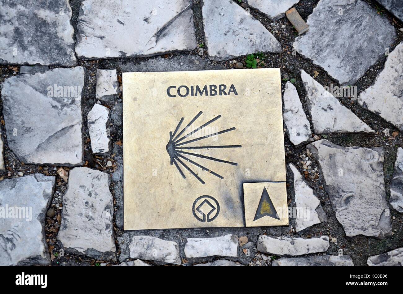 Plaque set in a cobbled street in Coimbra  showing the way path route to to The Camino Portuguese which spans from lLisbon to Sandiego Portugal Stock Photo