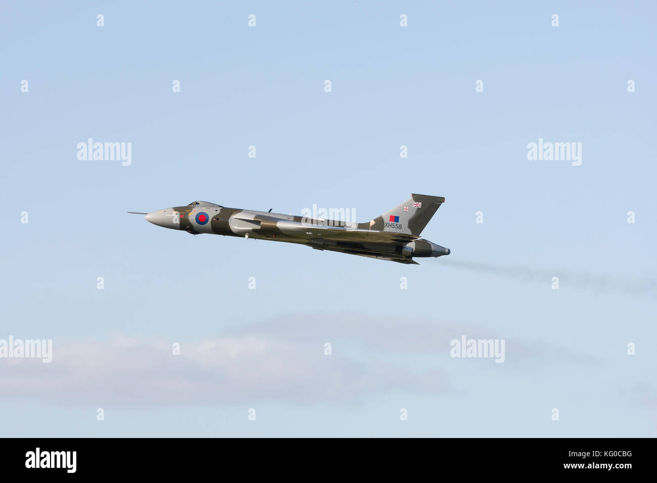 Vulcan bomber XH558 Spirit of Great Britain climbing away, jet pipes smoking Stock Photo