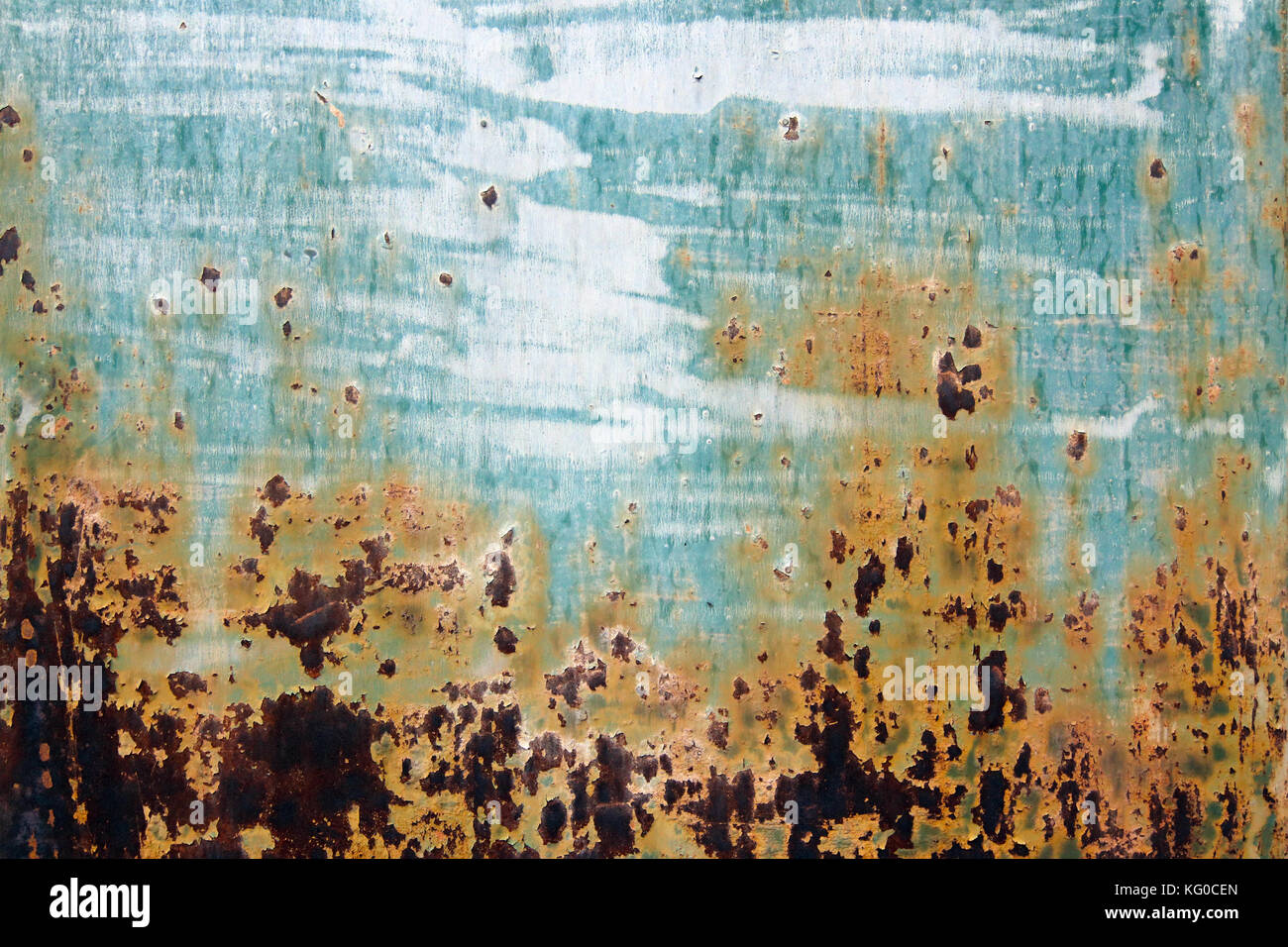 Flaking paint from the rusty metal surface Stock Photo