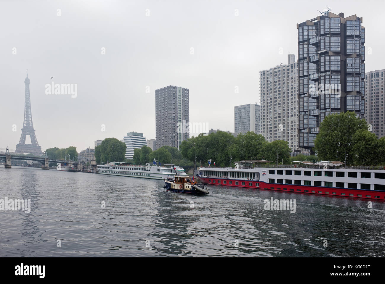 Paris; France-May 05; 2017: The port of Grenelle and the Swan Island. On the Seine a ship sails Stock Photo