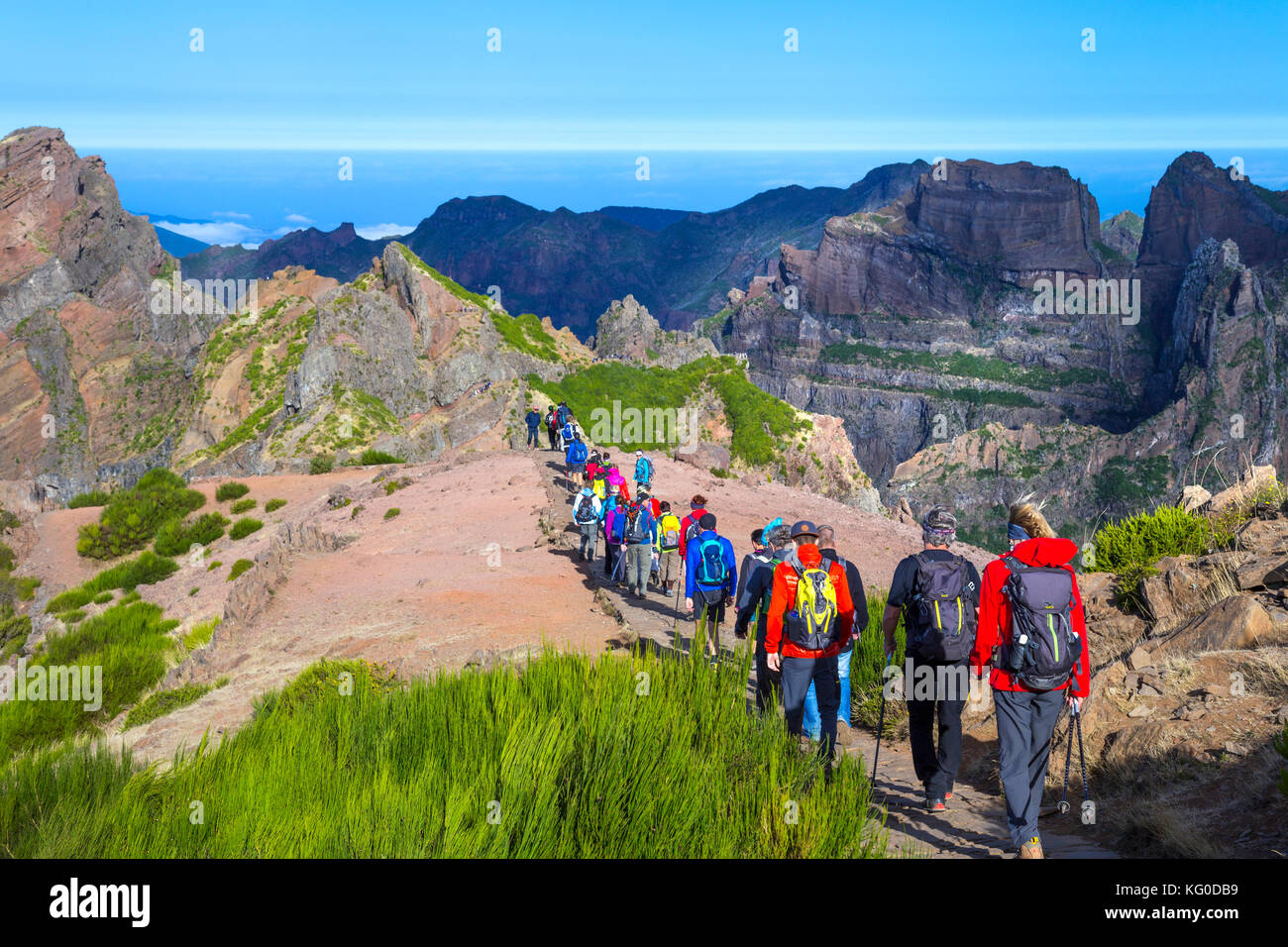 Group of hikers taking off from Pico do Arieiro on the trail towards Pico Ruivo - the highest peak in Madeira, Portugal Stock Photo