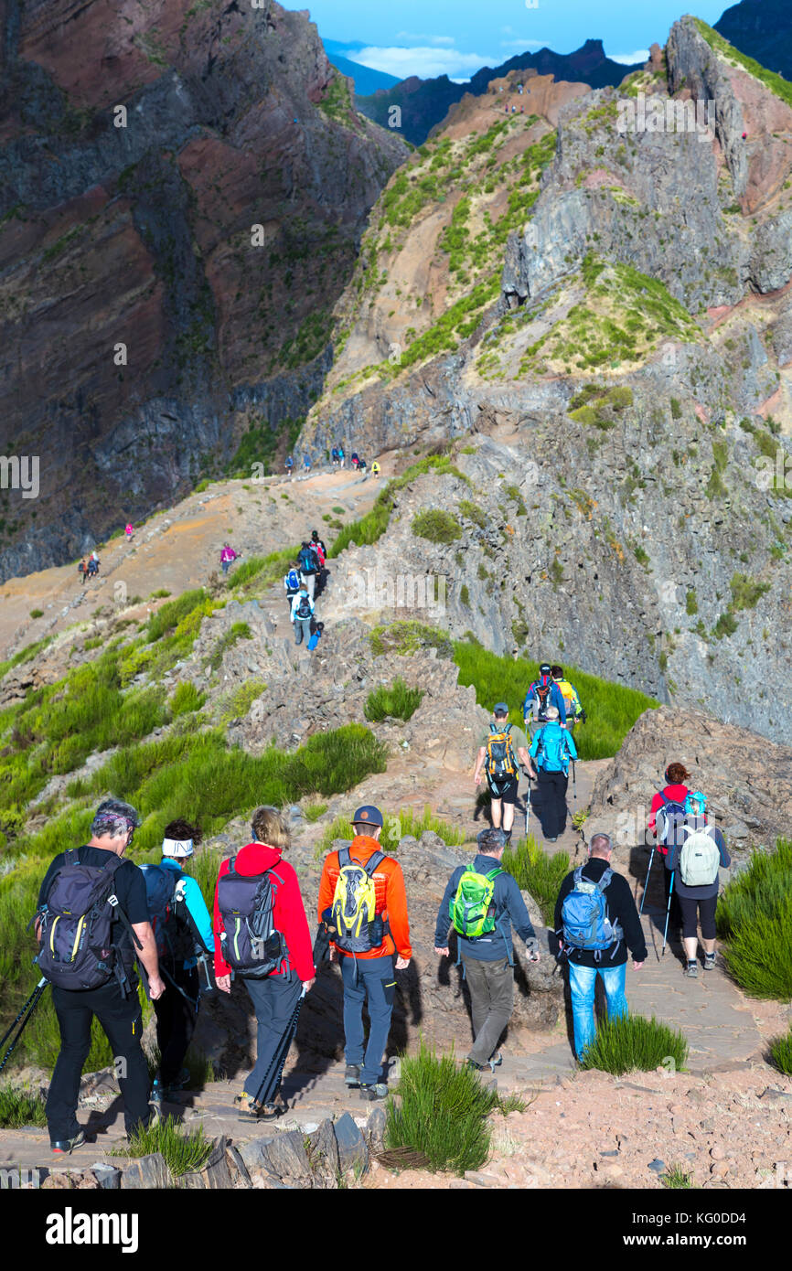 Hikers taking off from Pico do Arieiro on the trail towards Pico Ruivo - the highest peak in Madeira, Portugal Stock Photo