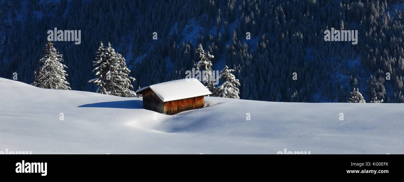 Hut surrounded by new snow Stock Photo - Alamy