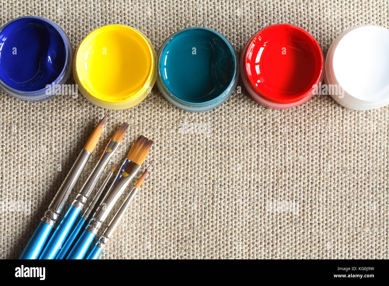 Set of paintbrushes and paint on canvas background Stock Photo Alamy