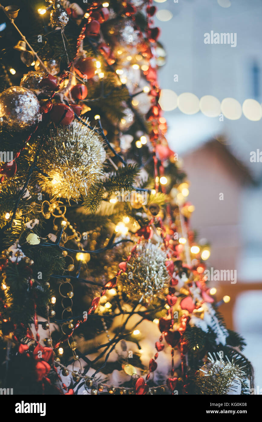 Decorated and illuminated christmas tree. Selective focus, toned image Stock Photo