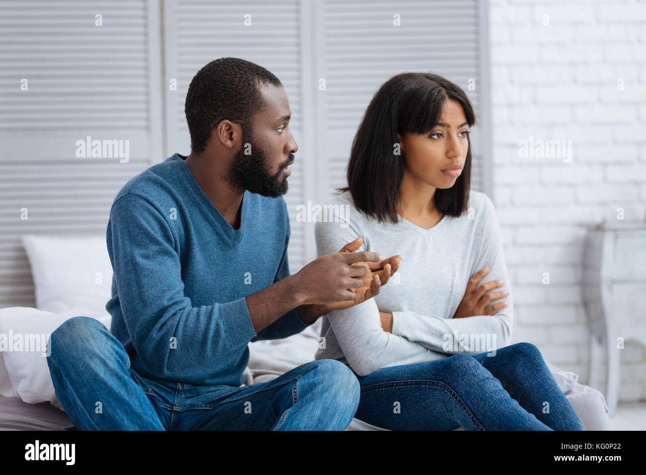 Kind calm man explaining the situation to his girlfriend Stock Photo ...