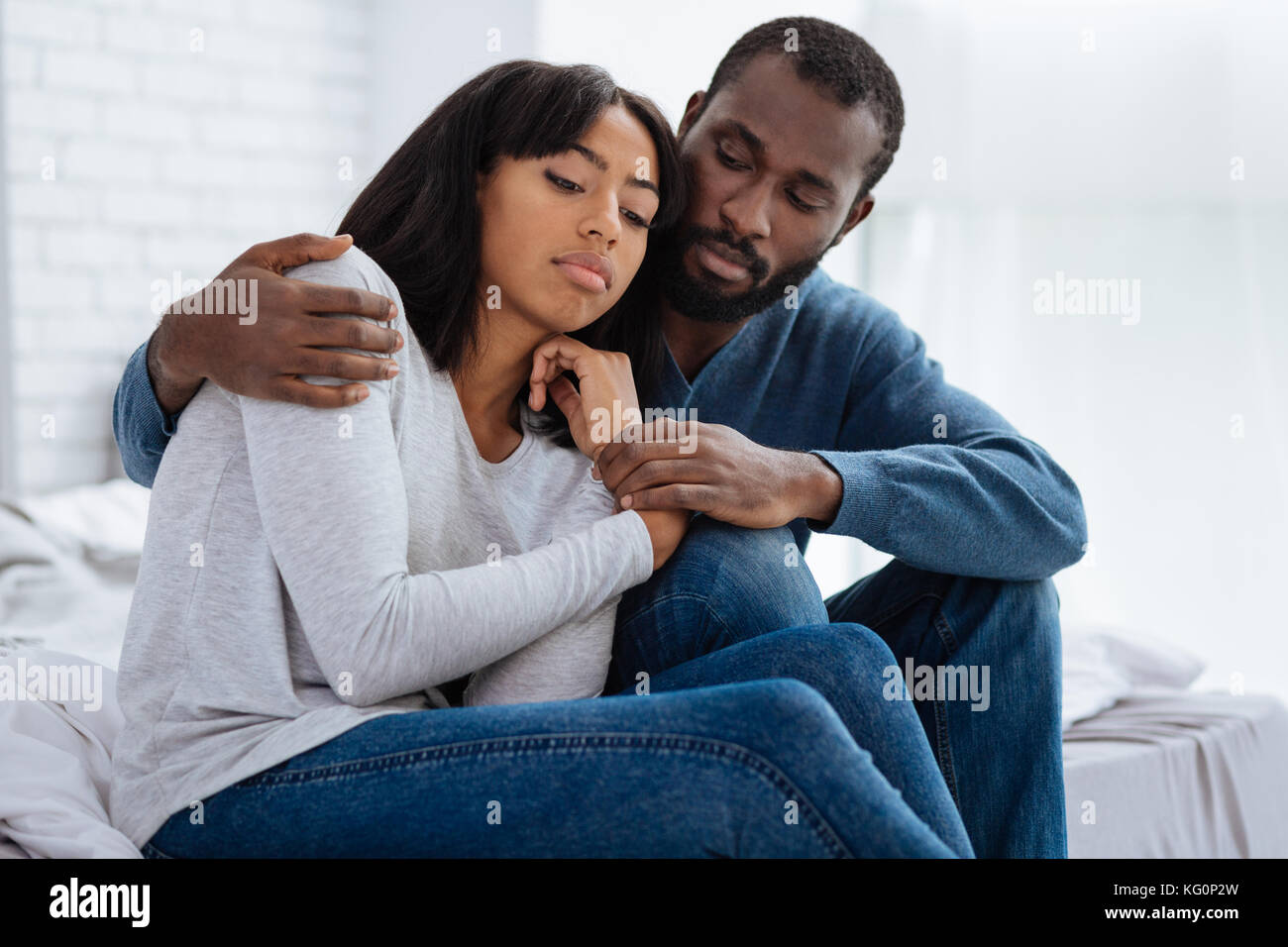 Kind loving man hugging his girlfriend Stock Photo