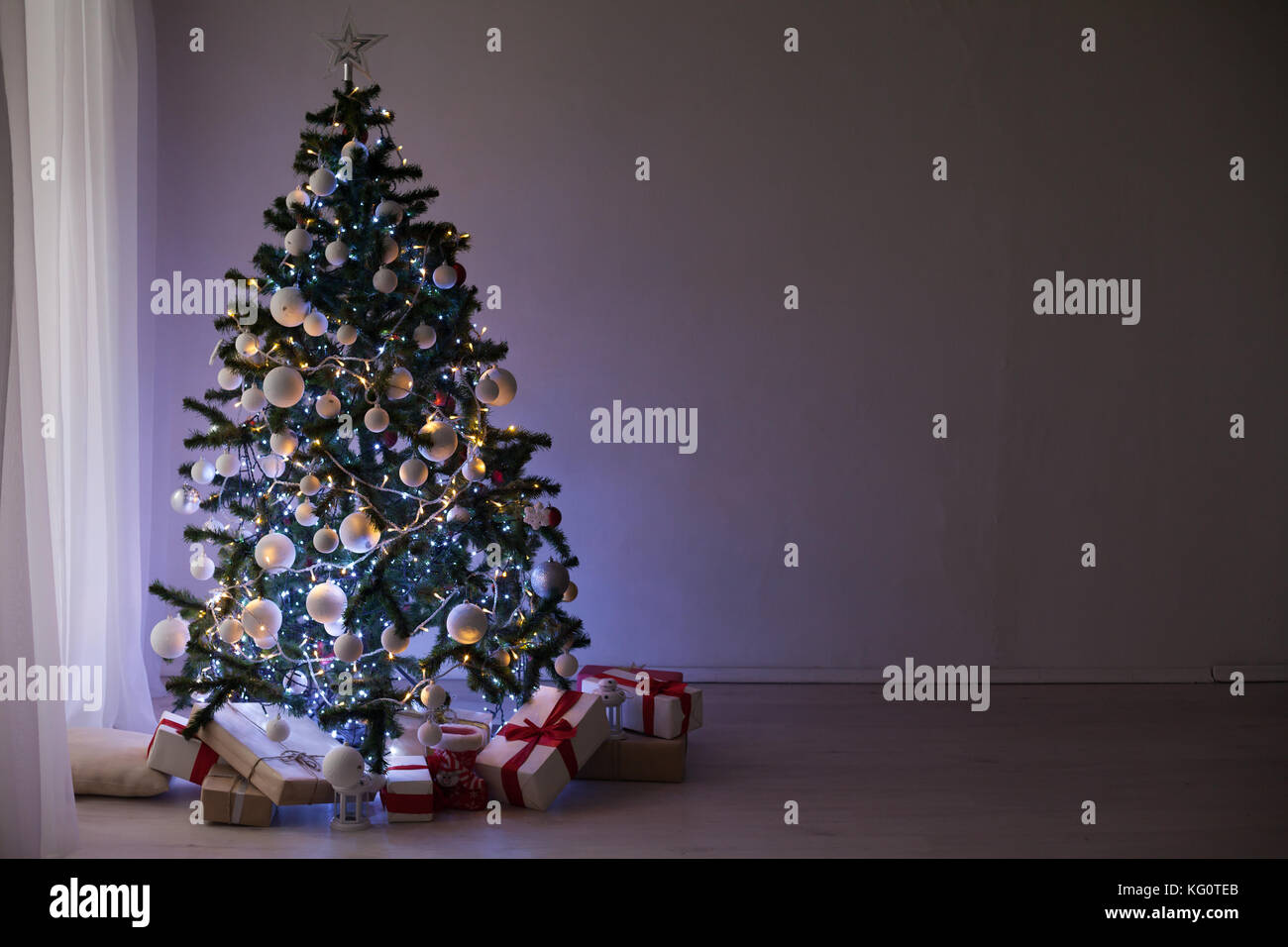 garlands of lights on a Christmas tree for Christmas Decor Stock Photo ...