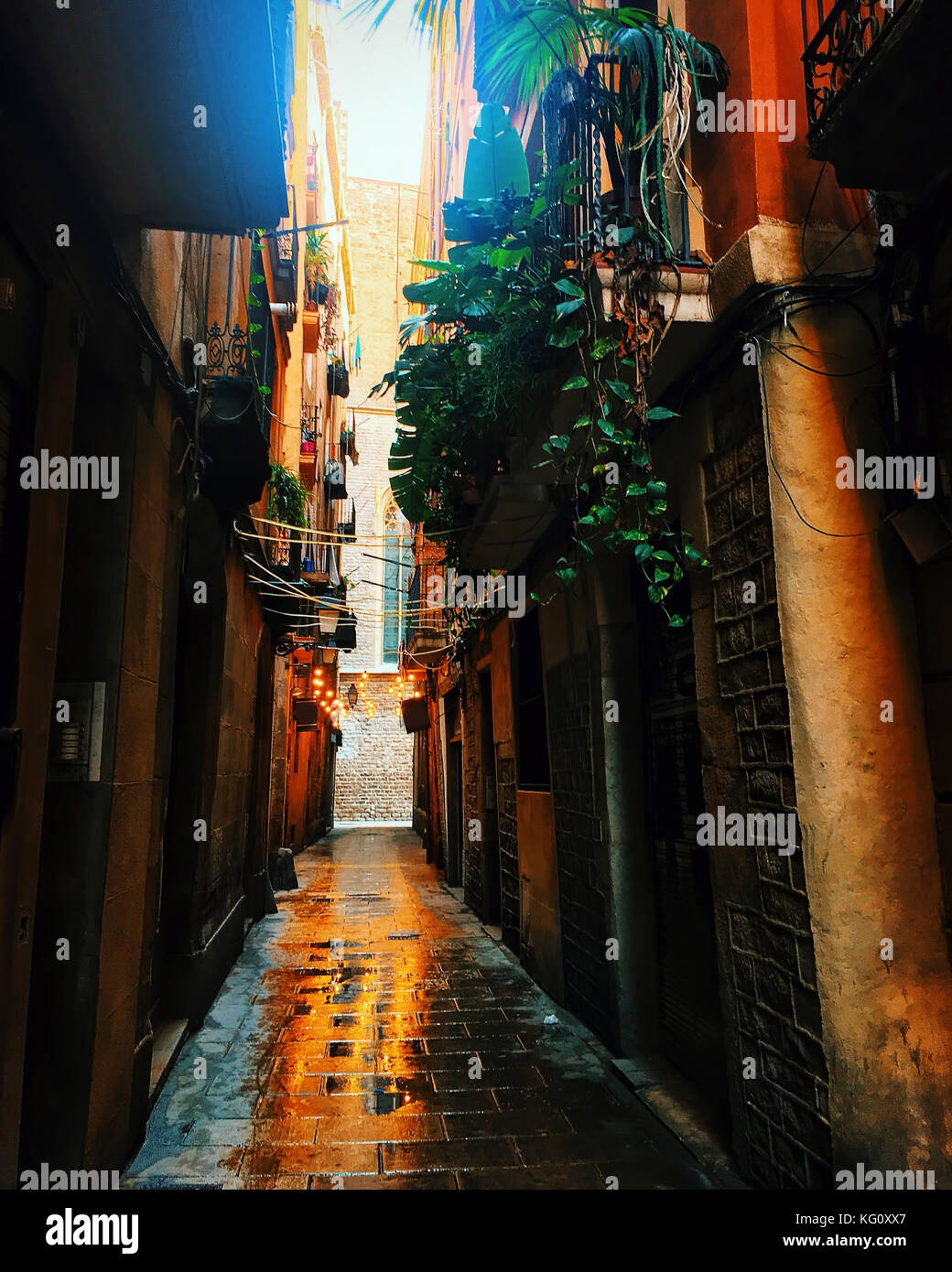 view looking down a narrow street in the Gothic Quarter, Old Town, of Barcelona, Spain Stock Photo