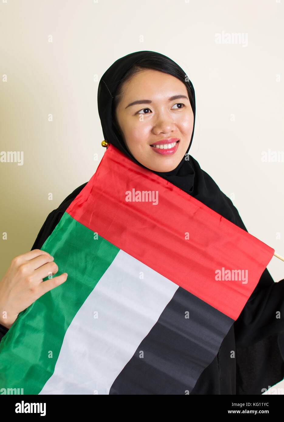 Muslim woman with the United Arab Emirates flag Stock Photo