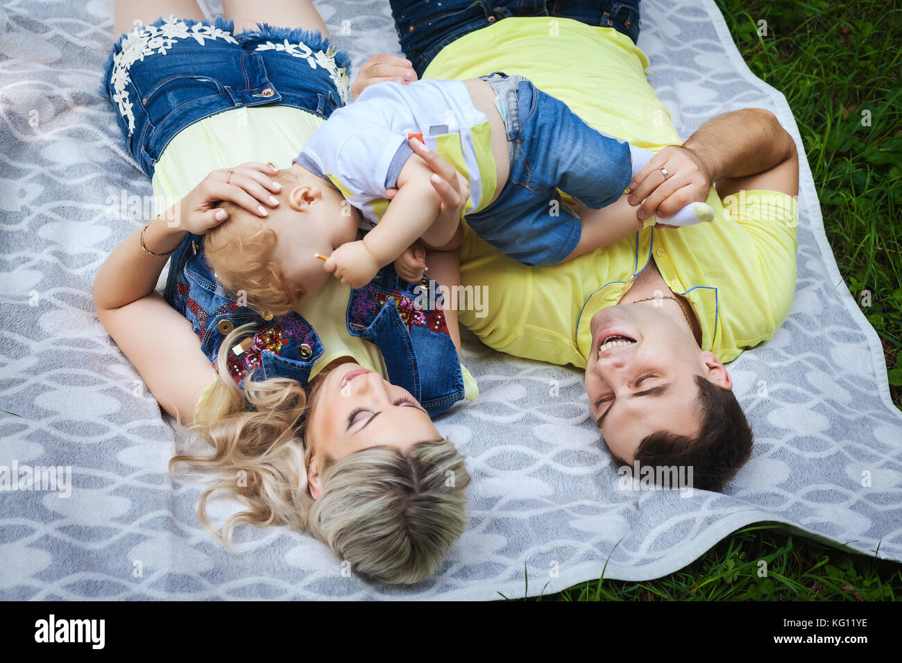 happy family resting in park Stock Photo - Alamy