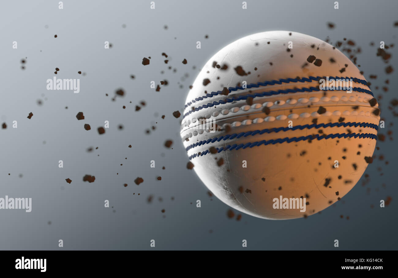 A dirty white leather cricket ball caught in slow motion flying through the air scattering dirt